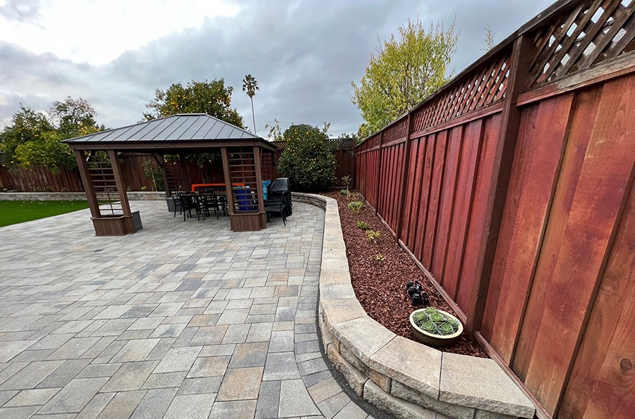 paver patio designs, retaining wall and pergola