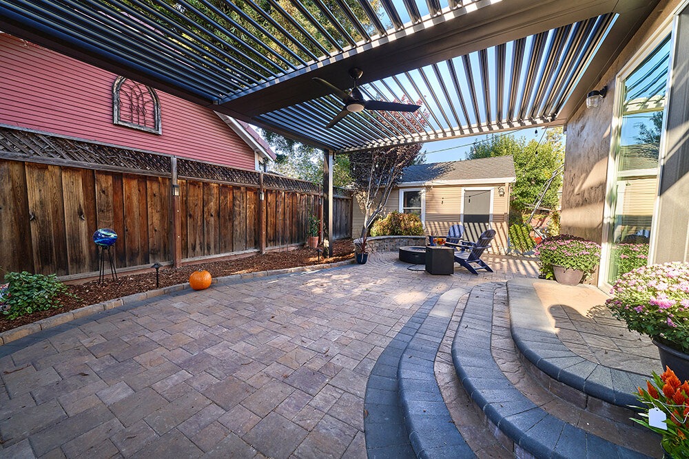 paver patio, steps and patio cover by Opulands.