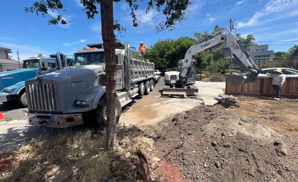 front yard renovation showing dump truck