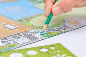 Landscape design contractor sketching a rendition of a landscaping concept.