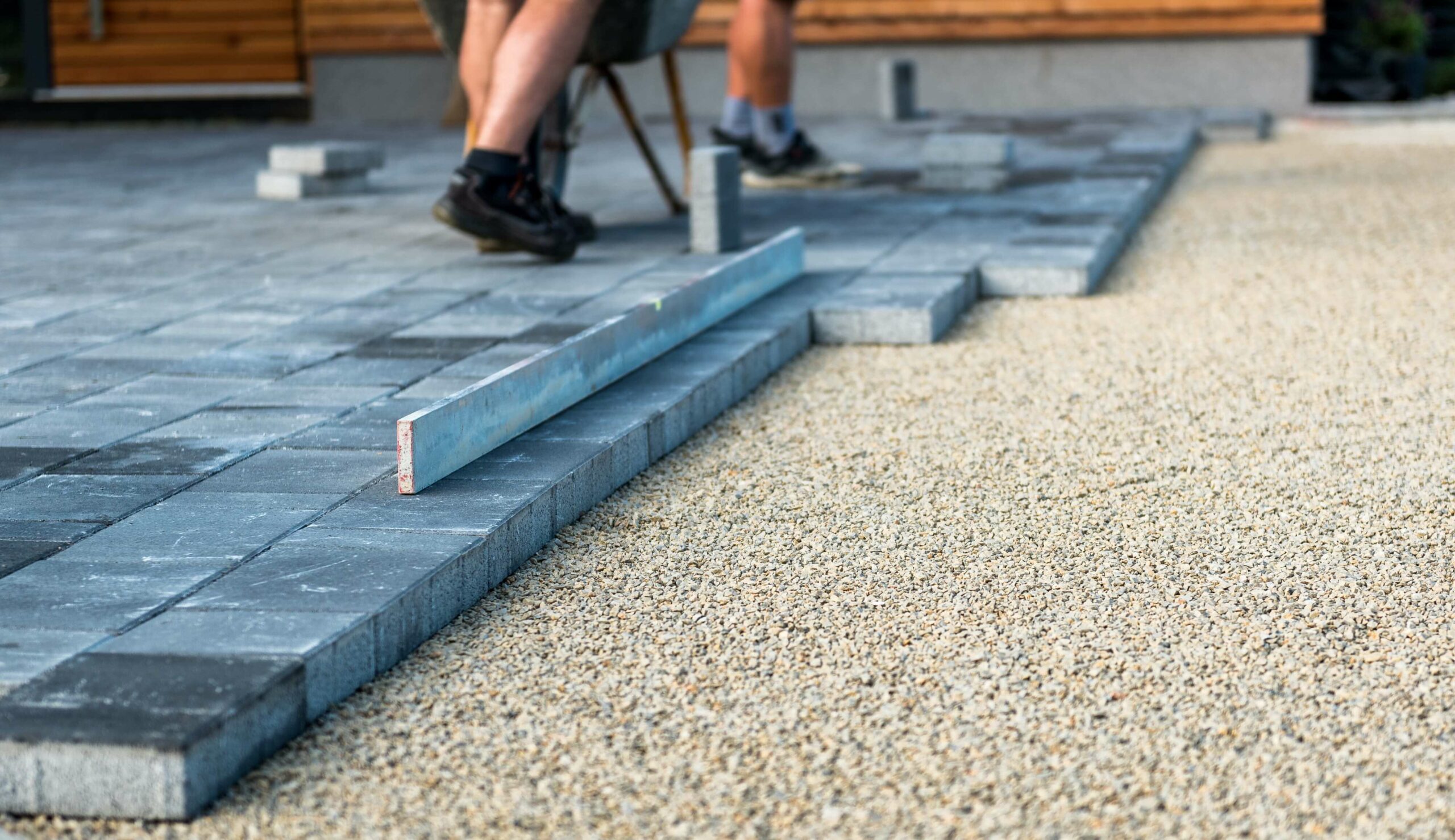 Paver patio contractors working on installing a paver patio.