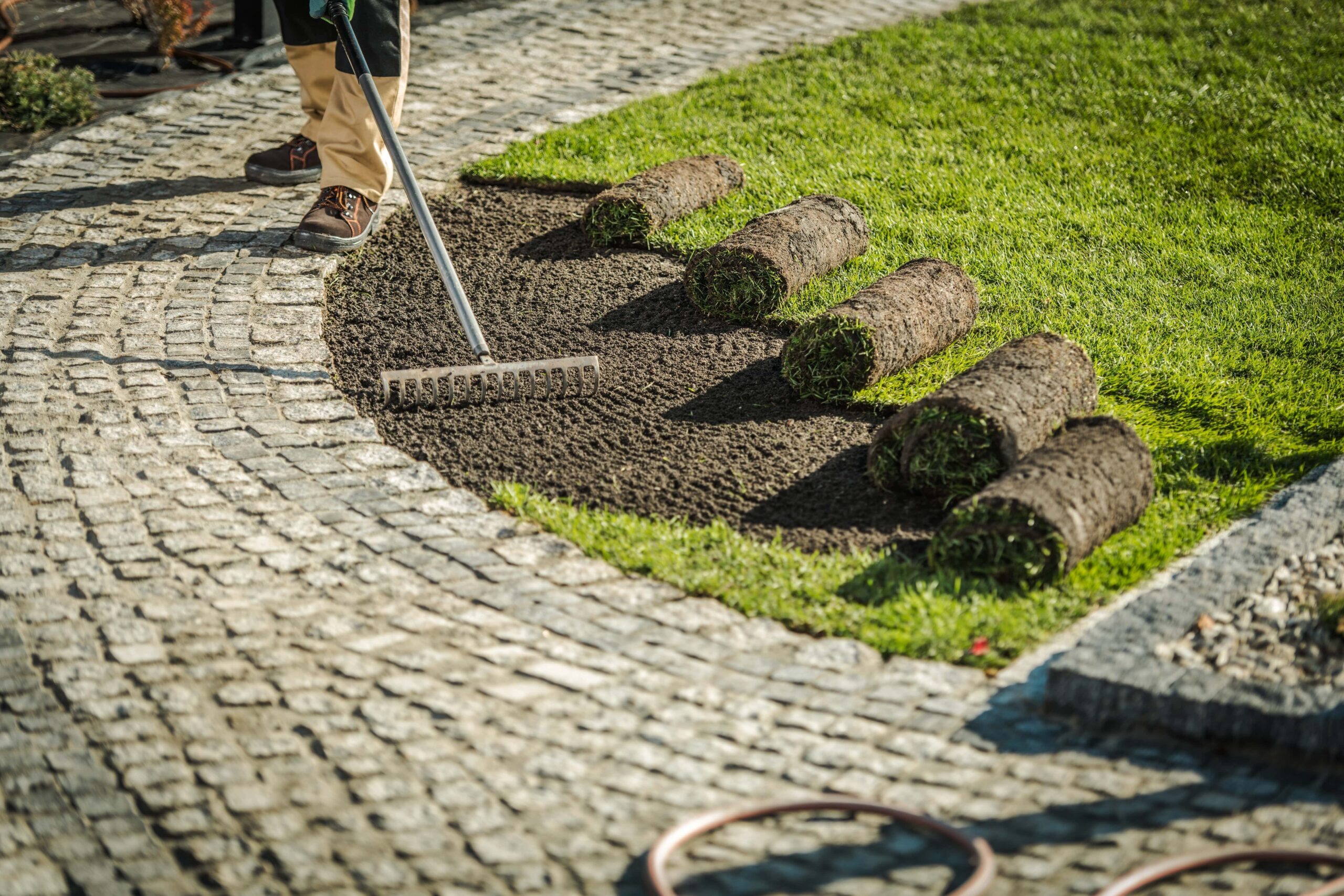 Landscaping contractor performing a landscape installation.