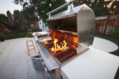 custom outdoor kitchen builders with a fire